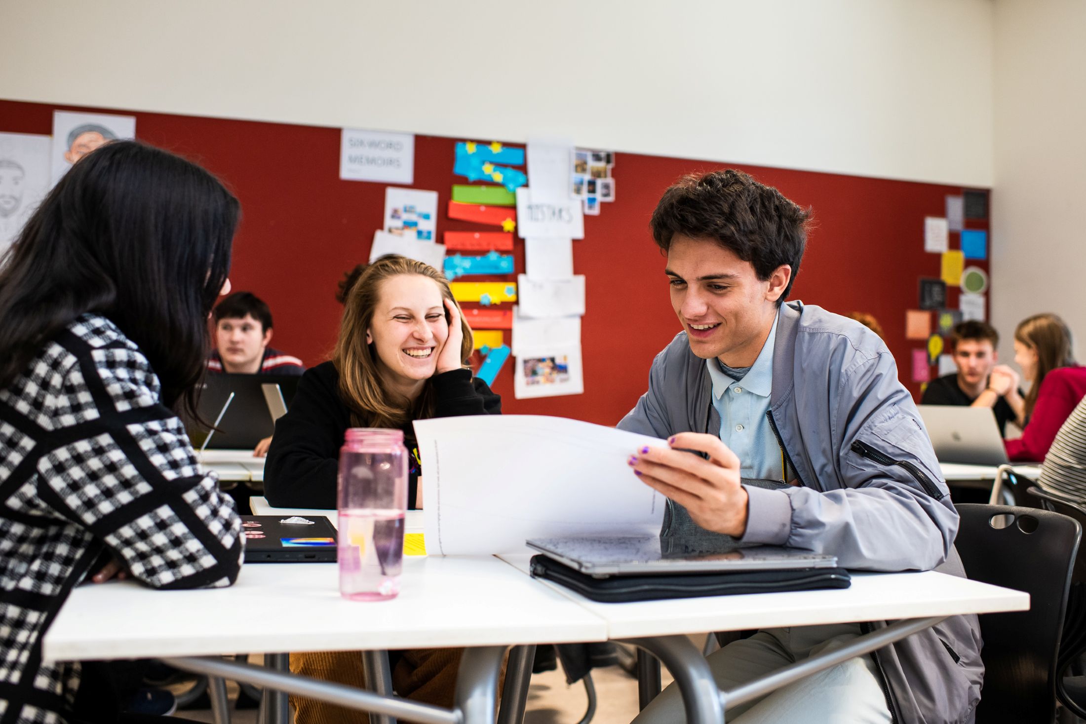 Students looking happy in a classroom