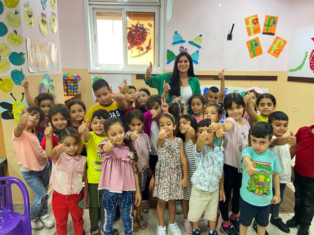 Mai AlQaisi with young students