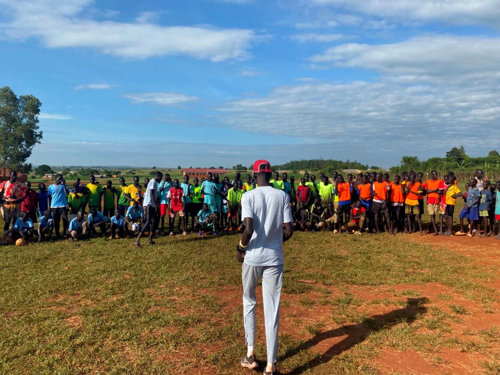 Peter running a sports camp in Kiryandongo refugee settlement