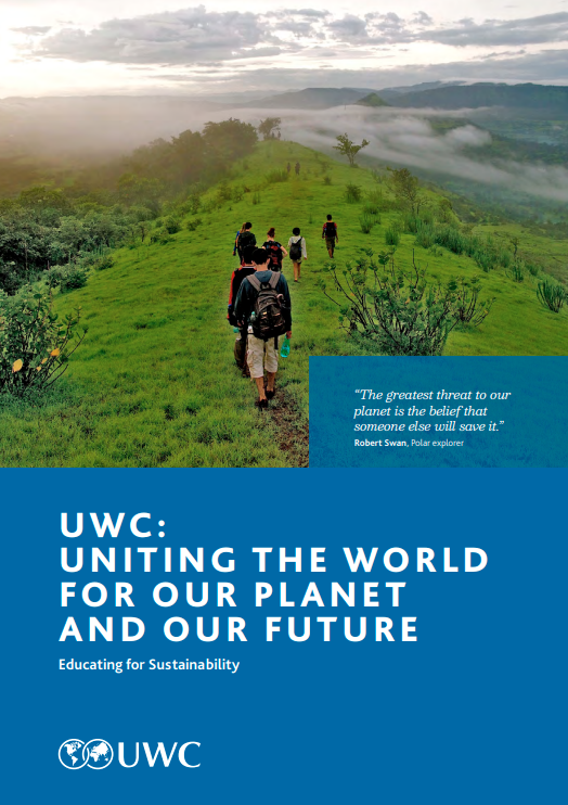 UWC sustainability brochure cover featuring  a group of people walking across a rural grassy ridge